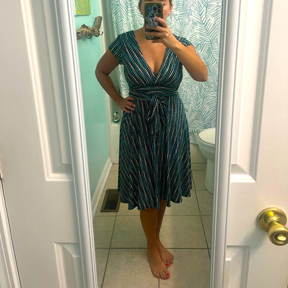 Ruby Rox dress with deep v neck and polka dots.  Tie in the front, size small